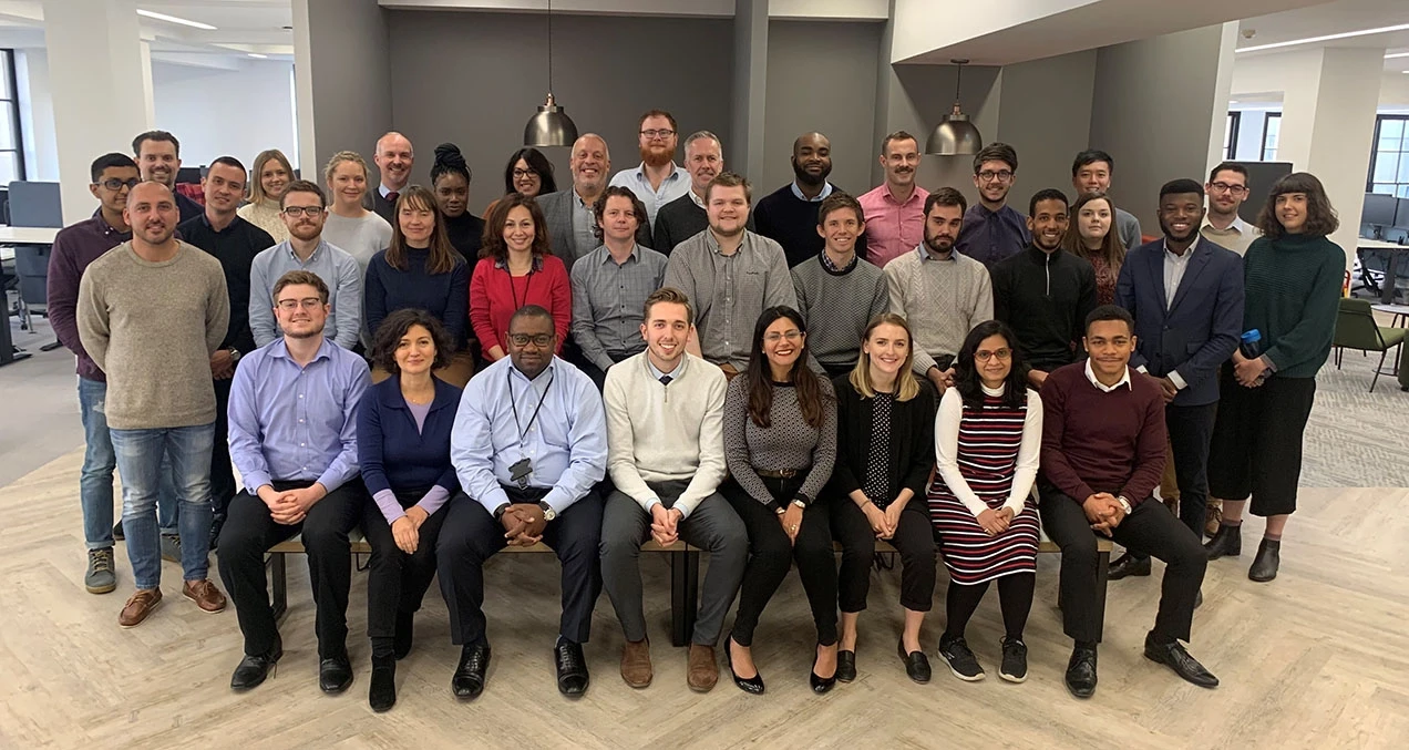 Group photo of the Flagstone team in the office