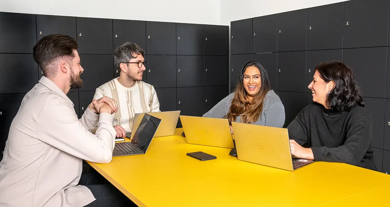 Group photo of the Flagstone team in the office